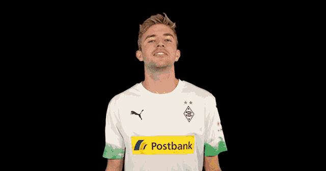 a man wearing a white shirt with a postbank logo
