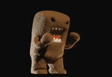 a stuffed animal that looks like a shark with its mouth open