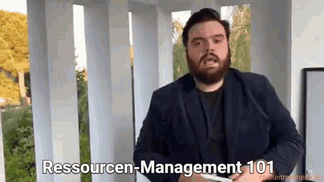 a man with a beard is holding a piece of paper and says resourcen-management 101