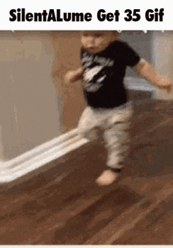 a baby is walking on a wooden floor with the words silentalume get 35 gif below him .