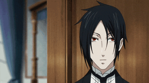 a man with black hair and red eyes is wearing a suit and tie