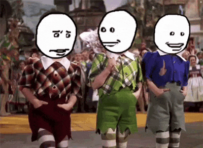 three cartoon characters are standing next to each other in front of a crowd .