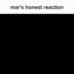 a close up of a girl 's face with the words `` mar 's honest reaction '' written above it .