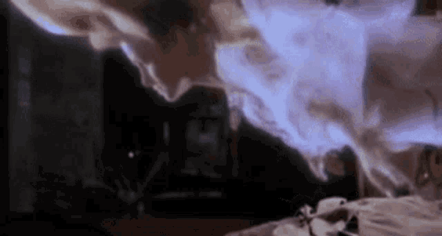 a person is laying on a bed with a ghost coming out of their chest .