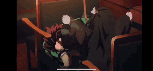 a person is laying on the floor with a red light coming out of their hair .