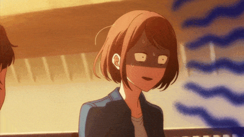 a girl in a blue jacket is making a silly face