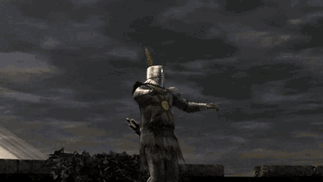 a statue of a knight with his arms outstretched and a foreign language written on the bottom right
