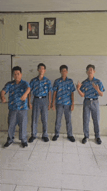 a group of boys are standing in front of a whiteboard that says matematika