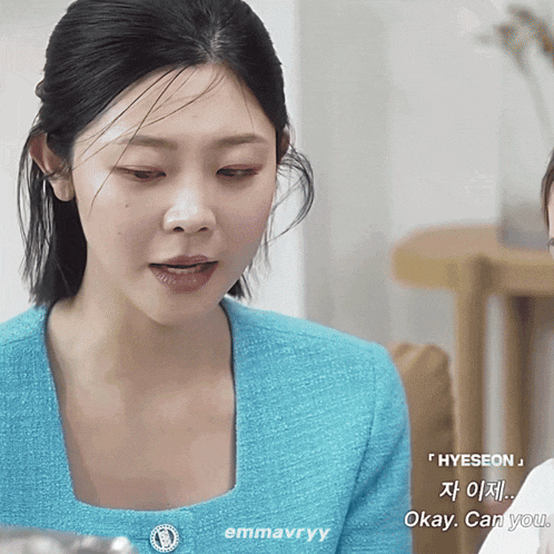 a woman in a blue sweater says okay can you in korean