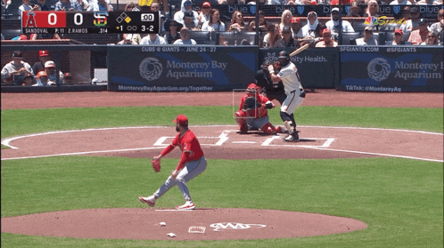 a baseball game is being played between the angels and the giants