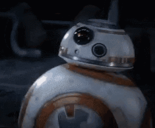 a close up of a bb-8 robot from star wars in a dark room .