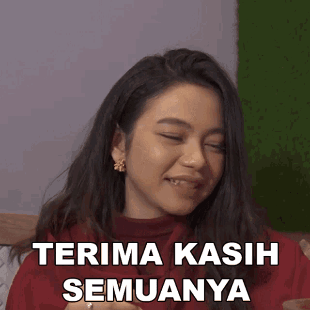 a woman with her eyes closed and the words terima kasih semuanya written below her
