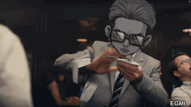a man in a suit and tie is holding a piece of paper with the letters egmi on the bottom