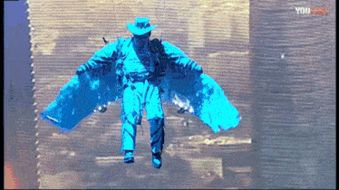 a man in a cowboy hat is flying through the air with blue wings and the words you first on the bottom right