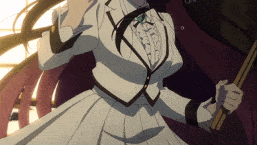 a woman in a white dress and black trim is holding a stick