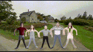 a group of people are holding hands on a road