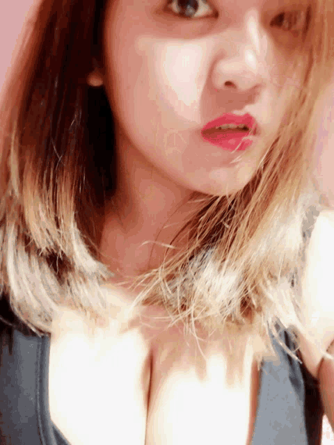 a close up of a woman wearing red lipstick