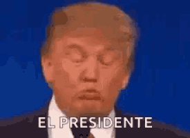 a close up of donald trump 's face with the words el presidente behind him .