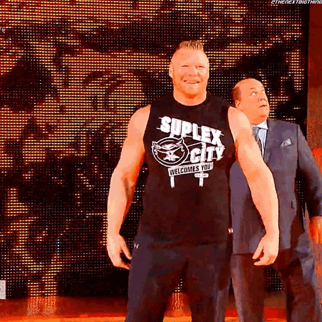a man in a black tank top that says suplex city welcomes you