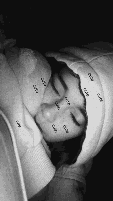 a black and white photo of a person with the word cute written on their face