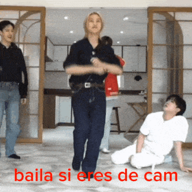 a group of people dancing in a room with the words baila si eres de cam