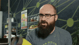 a man with a beard and glasses is wearing a shirt that says ' s.s. arium ' on it
