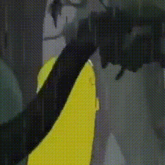 a close up of a yellow and black umbrella with a polka dot pattern .