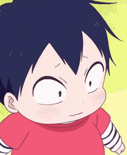 a little boy in a red shirt is making a funny face and making a funny face .