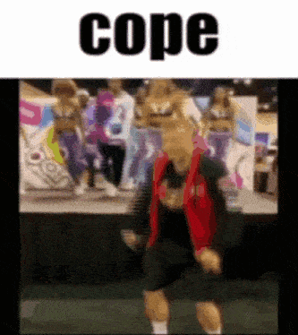 a blurred image of a person dancing with the word cope in the upper right corner