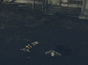 a person is laying on the ground in the dark .