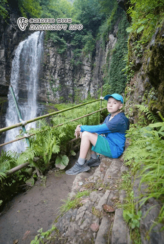 a boy sits on a rock near a waterfall created with avatarify