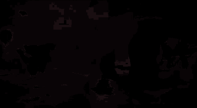 a silhouette of two bats flying through a sphere