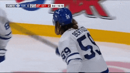 a hockey player wearing a jersey with the number 50 on it