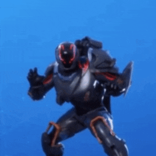 a robot with red eyes is standing on a blue surface .