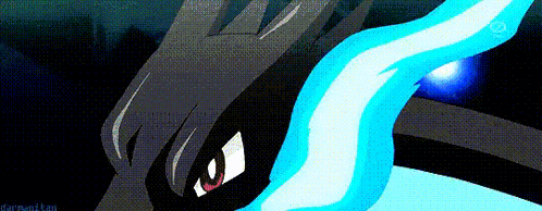 a close up of a pokemon with a blue flame coming out of it 's mouth .