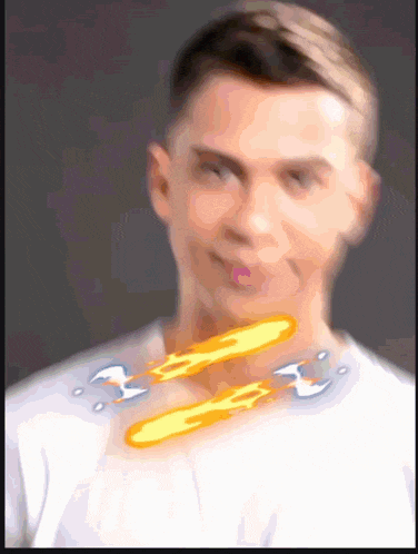a blurry picture of a man with a flame coming out of his neck