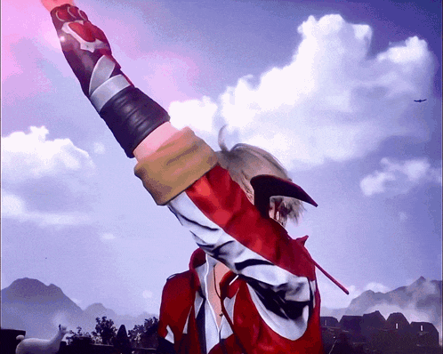 a person in a red and white jacket is holding up their arms in the air