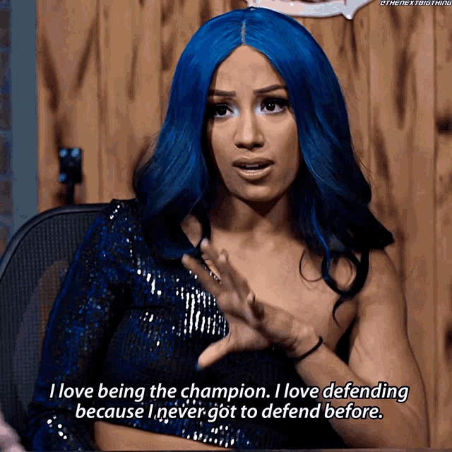 a woman with blue hair says i love being the champion