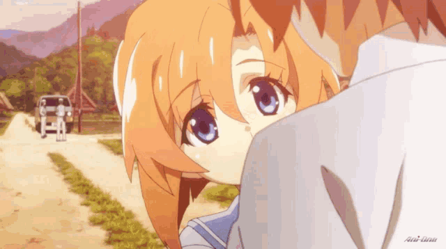 a girl with orange hair and blue eyes looks over the shoulder of a man