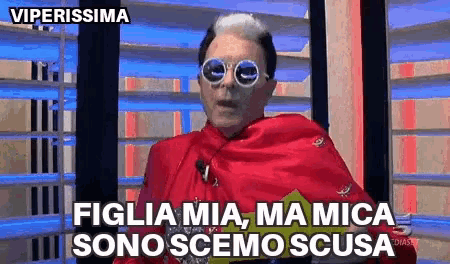 a man wearing sunglasses and a red cape says viperissima