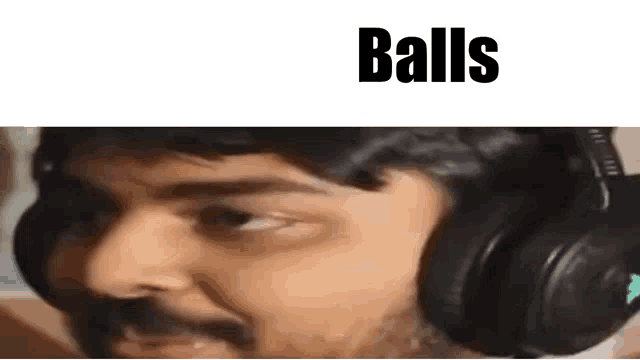 a close up of a man wearing headphones with the word balls written above him .