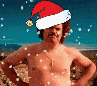 a shirtless man is wearing a santa hat