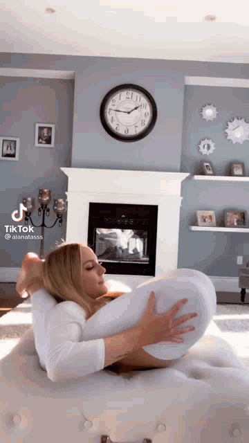 a tiktok video of a woman stretching her legs
