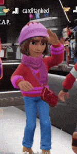 a girl in a pink hat and scarf is standing in front of a sign that says carditanked on it