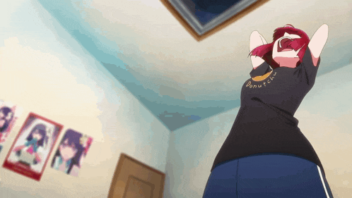 a girl with red hair is wearing a black shirt that says crunch on it