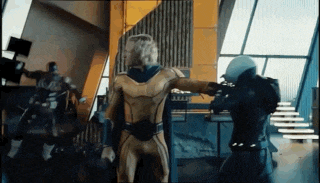 a man in a yellow suit is fighting another man