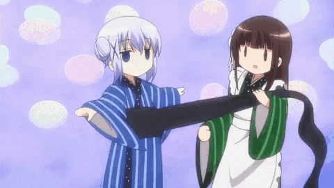 two anime girls are standing next to each other and one of them is holding a black object