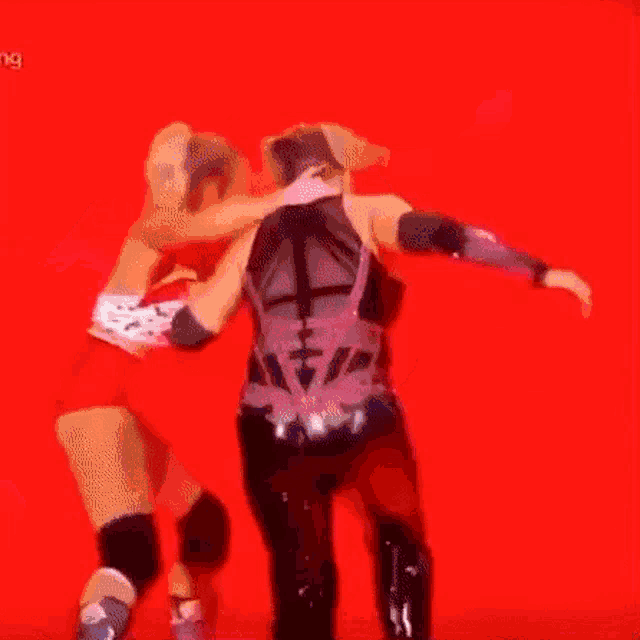 a person is falling down on a red background .