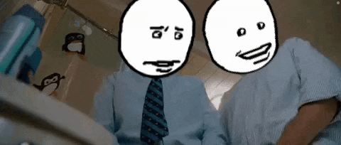 a couple of men with cartoon faces on their heads