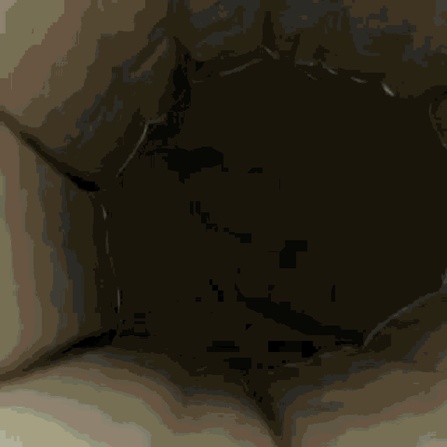 the inside of a brown bag with a hole in it
